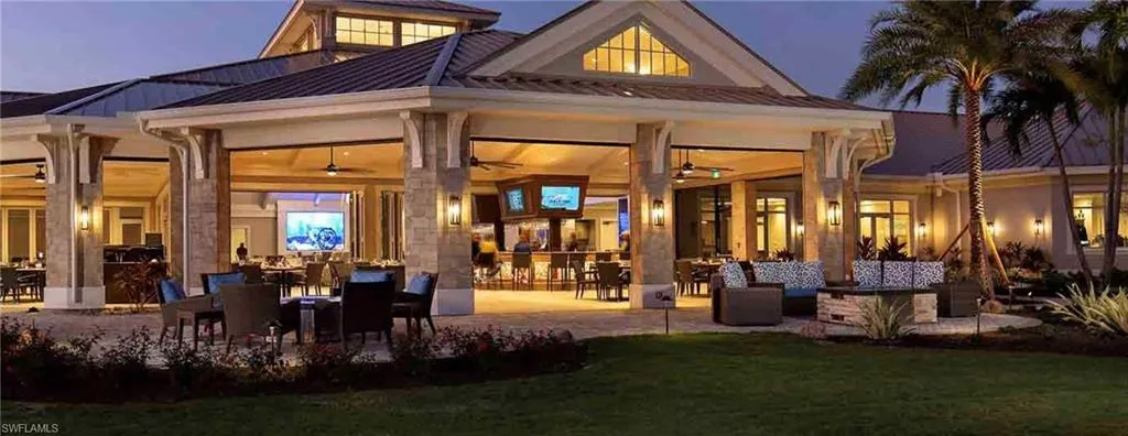 Back of property featuring a patio, a ceiling fan, and a lawn