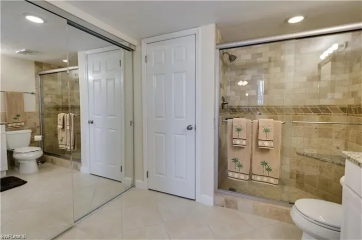 Bathroom with vanity, tile patterned floors, and toilet
