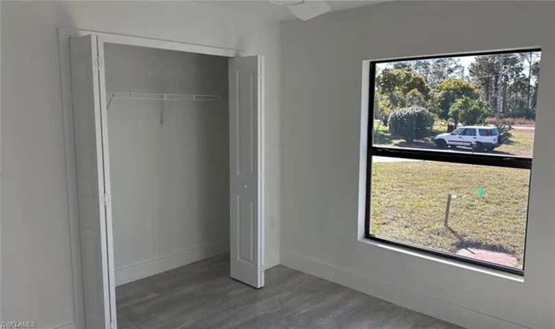 Unfurnished bedroom featuring a closet and ceiling fan
