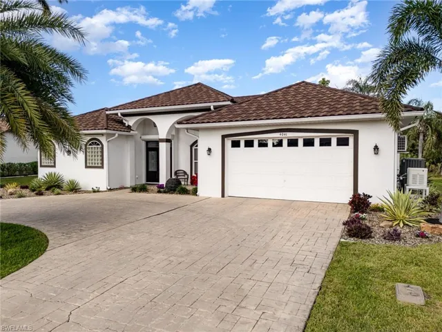 Mediterranean / spanish home with a garage
