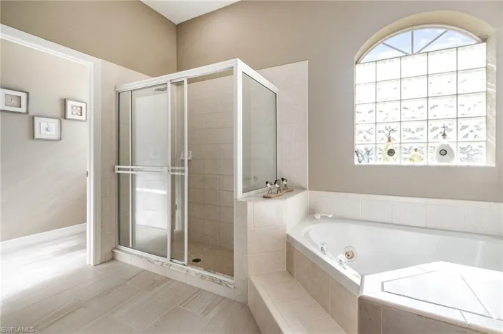 Bathroom with shower with separate bathtub