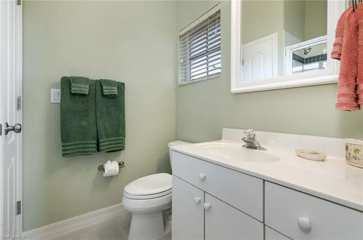 Ensuite Bathroom featuring vanity and toilet