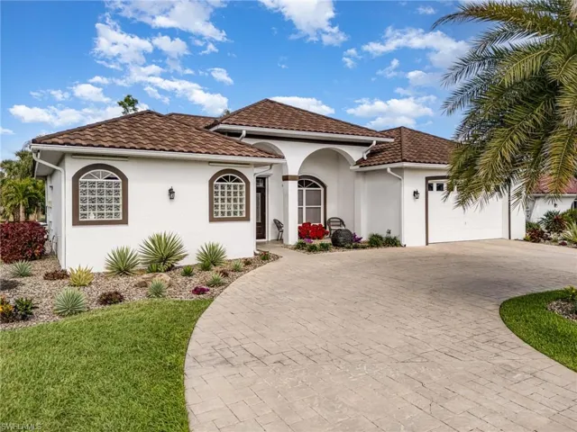 Mediterranean / spanish house featuring a garage