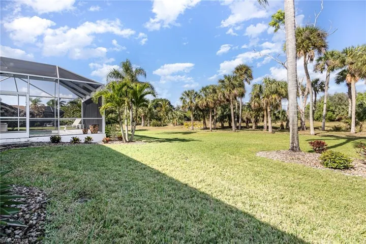 View of yard with a lanai