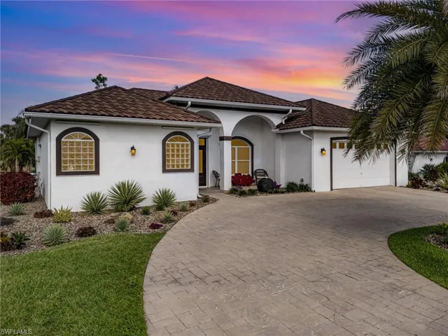 Mediterranean / spanish-style house with a garage