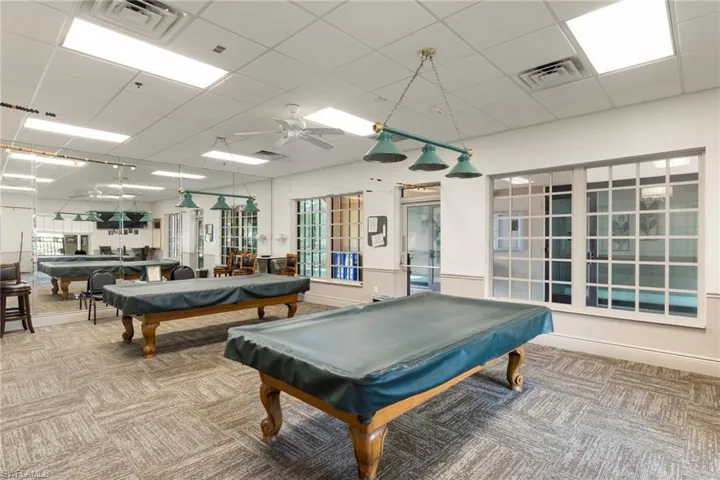 Clubhouse Billiards room, carpet floors, ceiling fan, and a paneled ceiling
