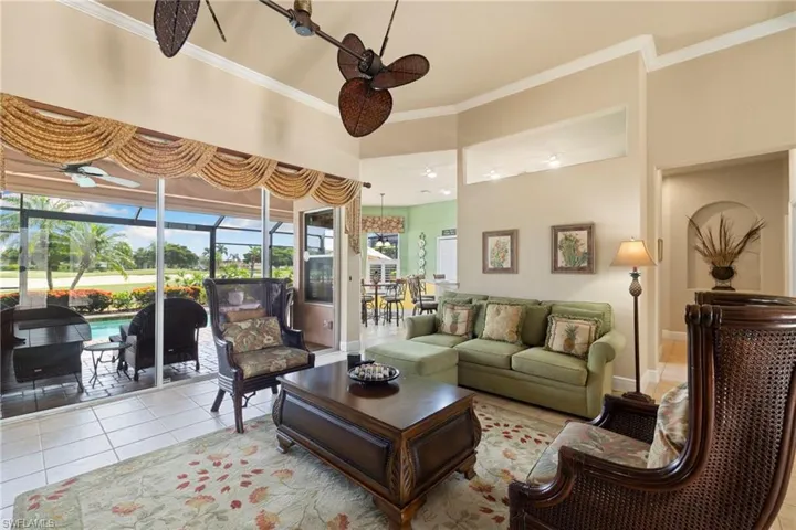 Family Room has sliding glass doors that lead out to the pool area and screened lanai.