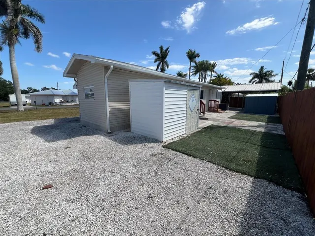 Garage featuring fence