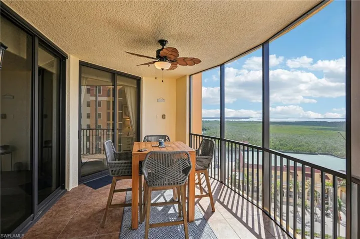Sunroom featuring ceiling fan