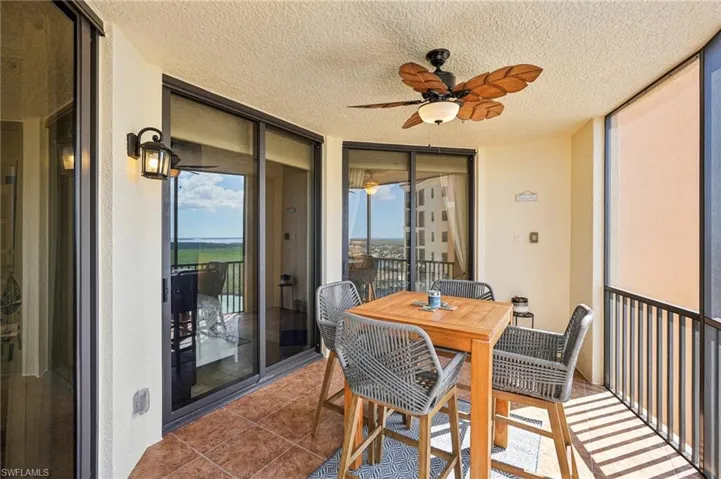 Sunroom / solarium featuring ceiling fan and a wealth of natural light