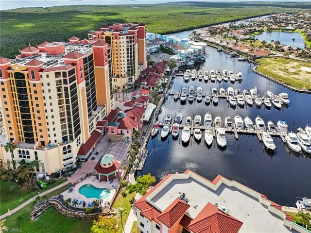 Birds eye view of property with a water view