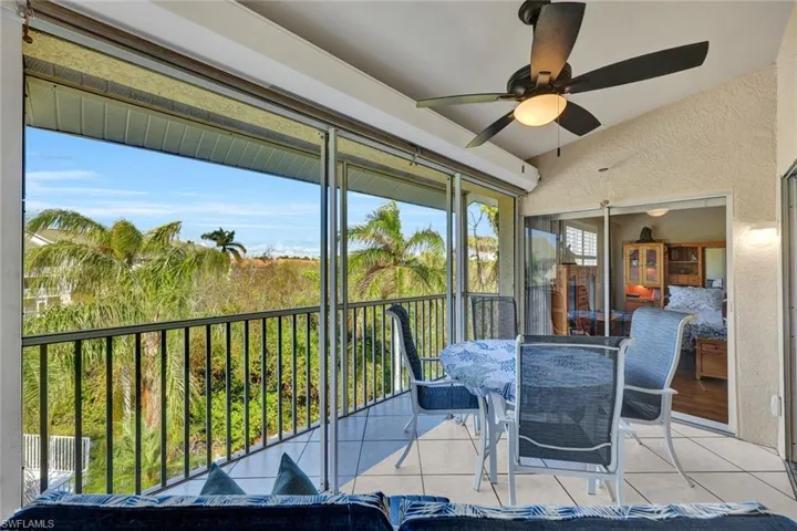 Sunroom featuring ceiling fan