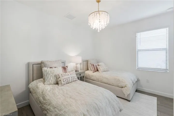 Bedroom with a notable chandelier