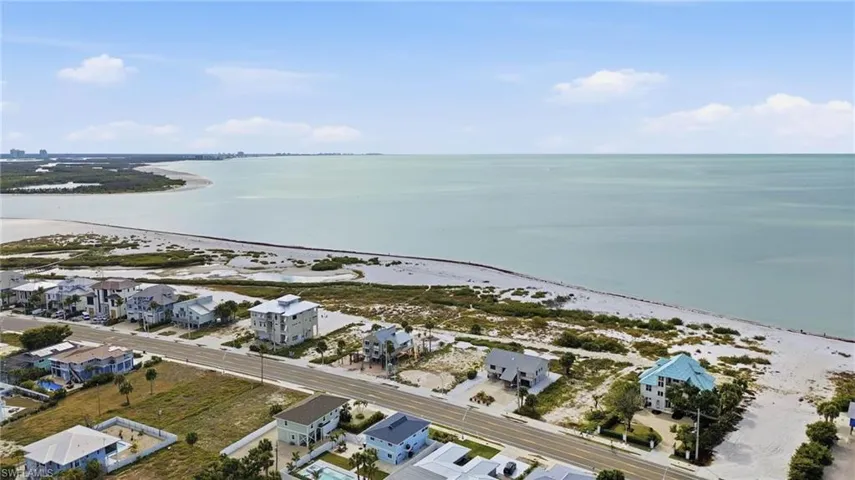 Aerial perspective of suburban area with a nearby body of water