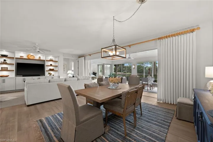 Open-concept living space with wood-finish flooring