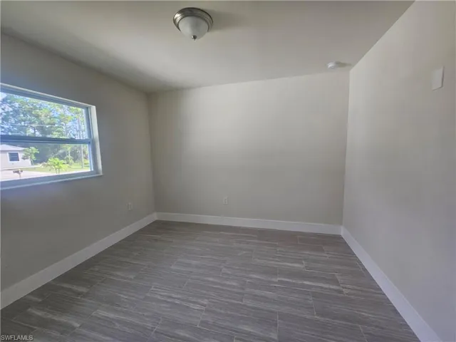 Empty room with baseboards