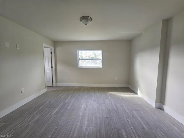 Empty room featuring light wood-style floors and baseboards