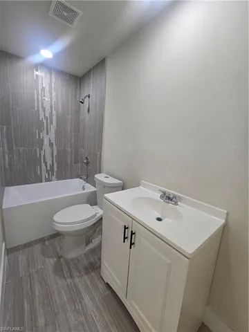 Full bath with bathtub / shower combination and vanity