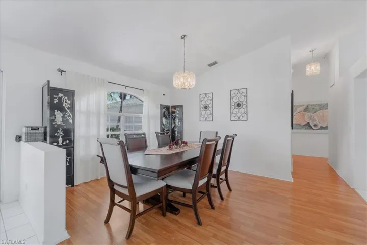 Dining space with a chandelier and light wood finished floors