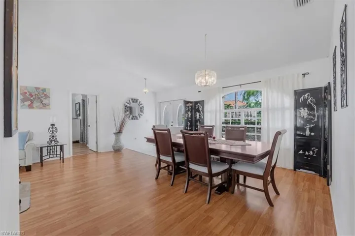 Dining room featuring a chandelier and light wood-type flooring