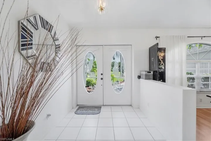 Foyer entrance featuring tile patterned floors