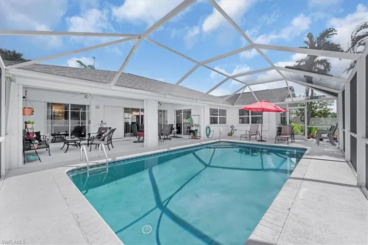 Swimming pool featuring a patio area and a lanai