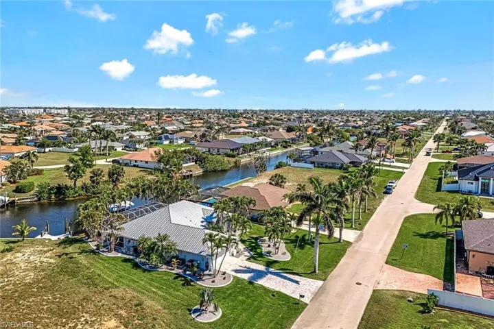 Drone / aerial view featuring a water view and a residential view