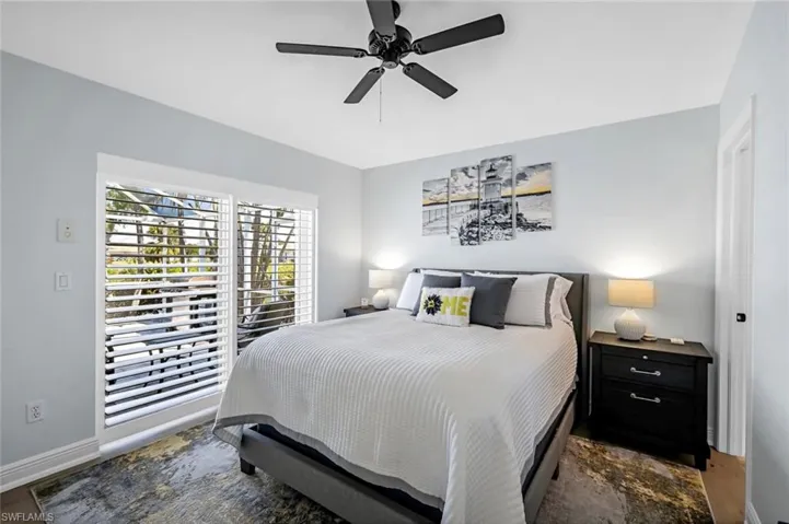 Bedroom featuring a ceiling fan and baseboards