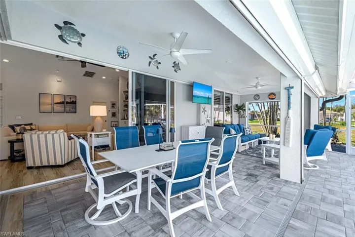 View of patio featuring an outdoor hangout area, outdoor dining space, visible vents, and a ceiling fan