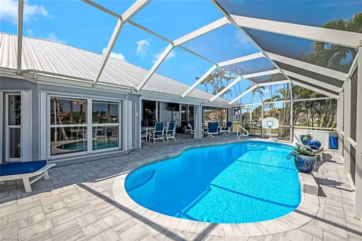 Pool with a lanai and a patio