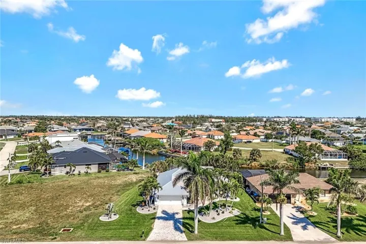 Aerial view featuring a water view and a residential view
