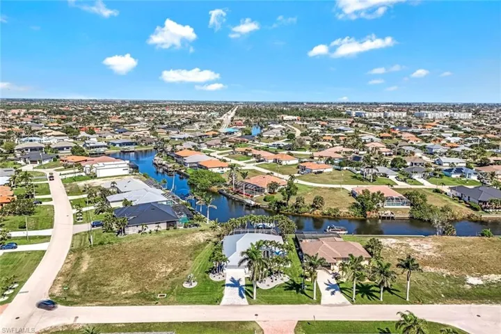 Aerial view with a water view and a residential view