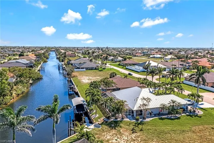 Aerial view featuring a water view and a residential view