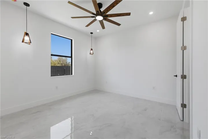 Spare room featuring recessed lighting and a ceiling fan