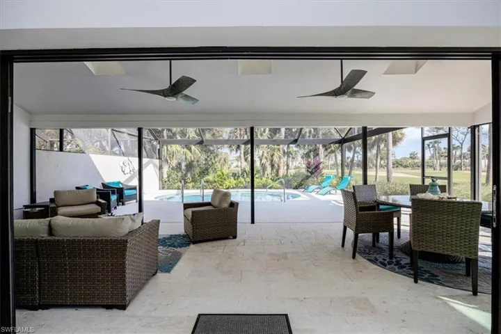 Lanai featuring a beautiful pool and view,