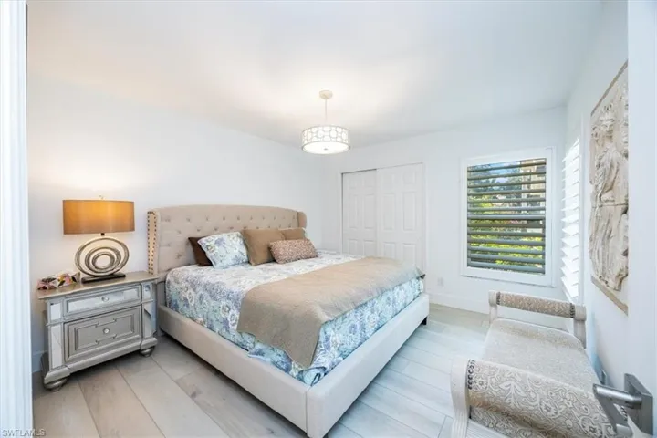Bedroom featuring light hardwood / wood-style flooring and a closet