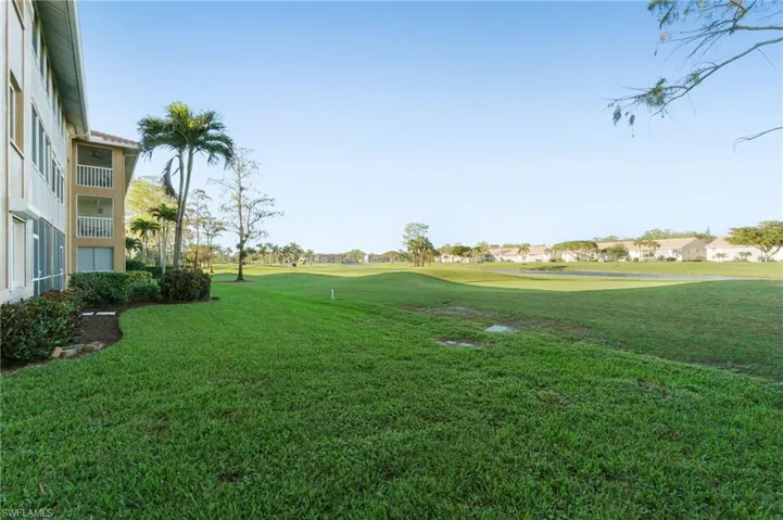 END UNIT, FIRST FLOOR, WALK OUT!  Golf Course and Lake Views!