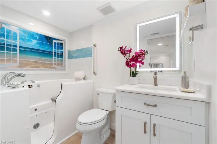 Guest bath offers a SPECTACULAR therapeutic tub with chromotherapy and jets!!  A $14k upgrade!