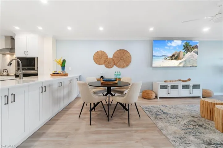 Designated dining area featuring abundant additional storage off of the kitchen