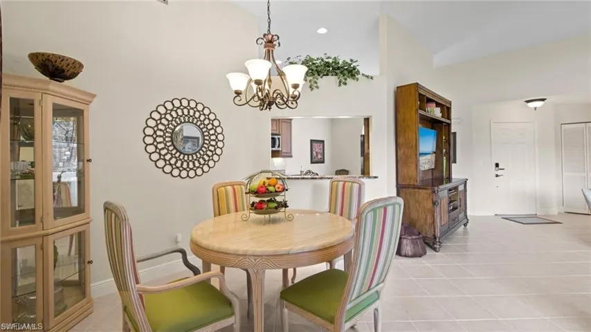 Dining space featuring a chandelier and light tile patterned floors