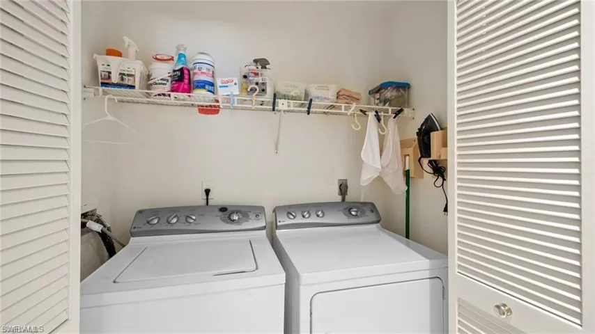 Laundry area featuring separate washer and dryer