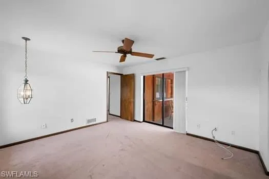 Unfurnished bedroom with ceiling fan, carpet flooring, and a closet