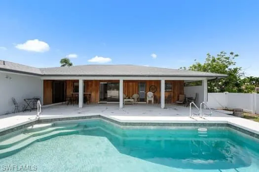 Outdoor pool featuring a patio area