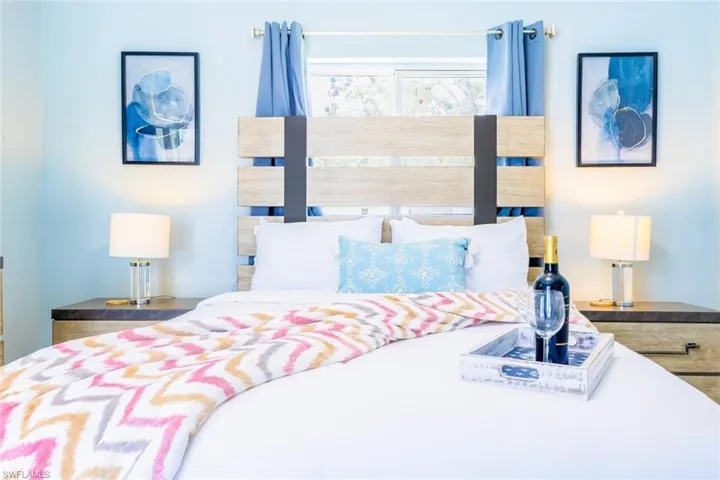 Light wood-finish headboard with metal accents