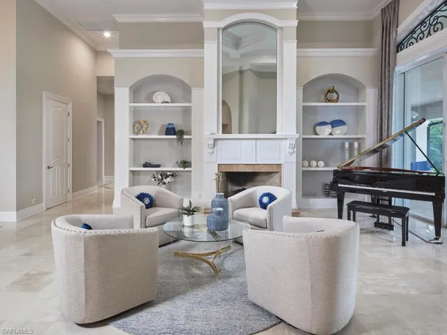 The grand fireplace is one of the many details to love about this home.