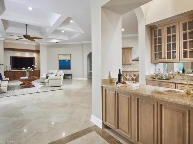 Your happiest of hours will be spent enjoying beverages at the bar in the center of the home.
