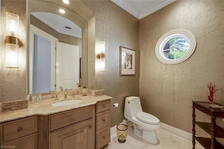 Powder room, located near formal living room and den.