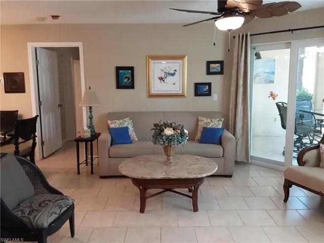 Living room featuring ceiling fan