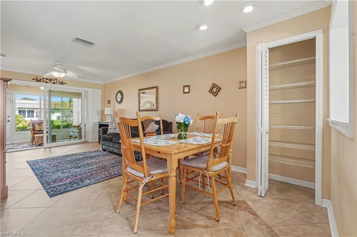 Dining area with added pantry closet.