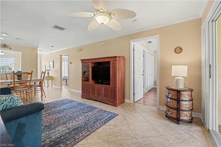 Living/dining room featuring access to the guest bedroom & bath, primary bedroom & lanai.